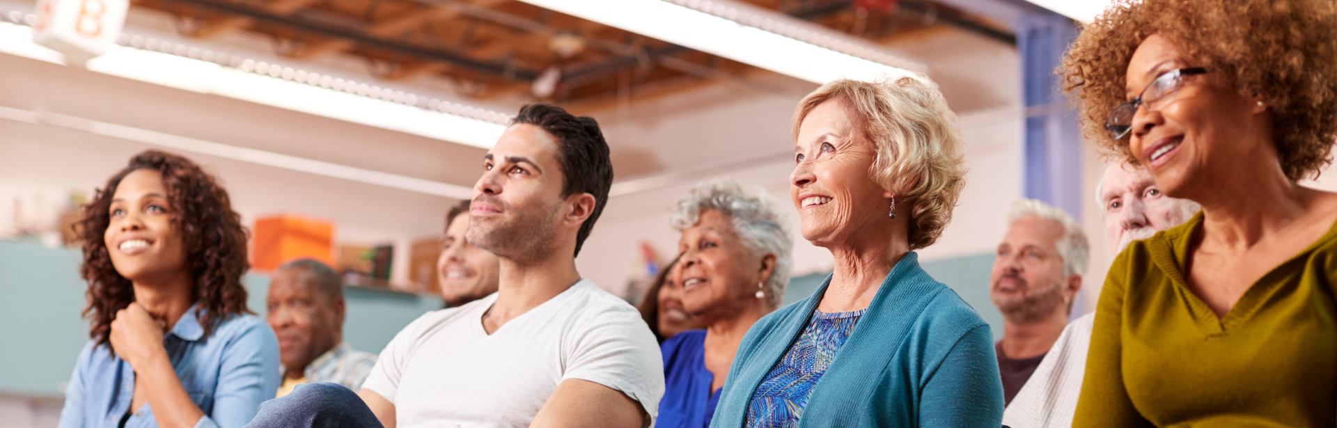 group of people smiling during meeting